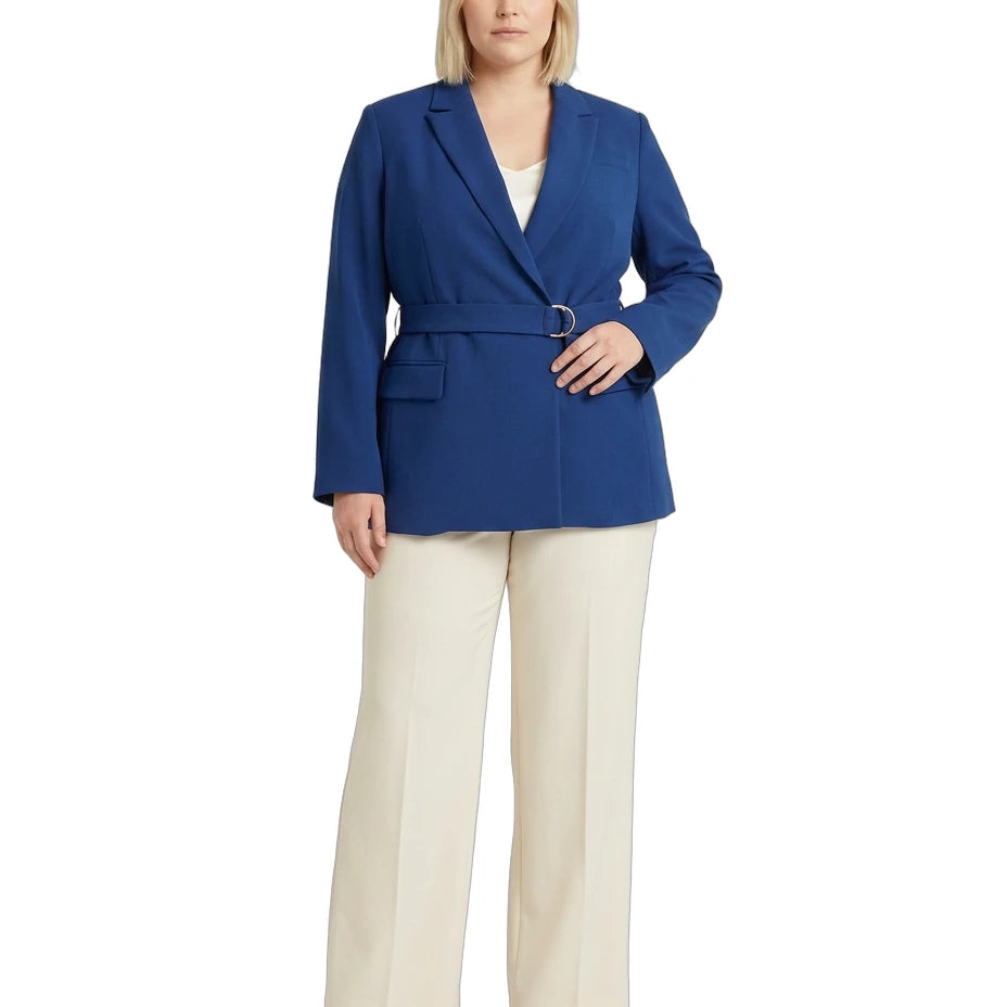 Woman wearing a Calvin Klein blue blazer and white pants on a white background