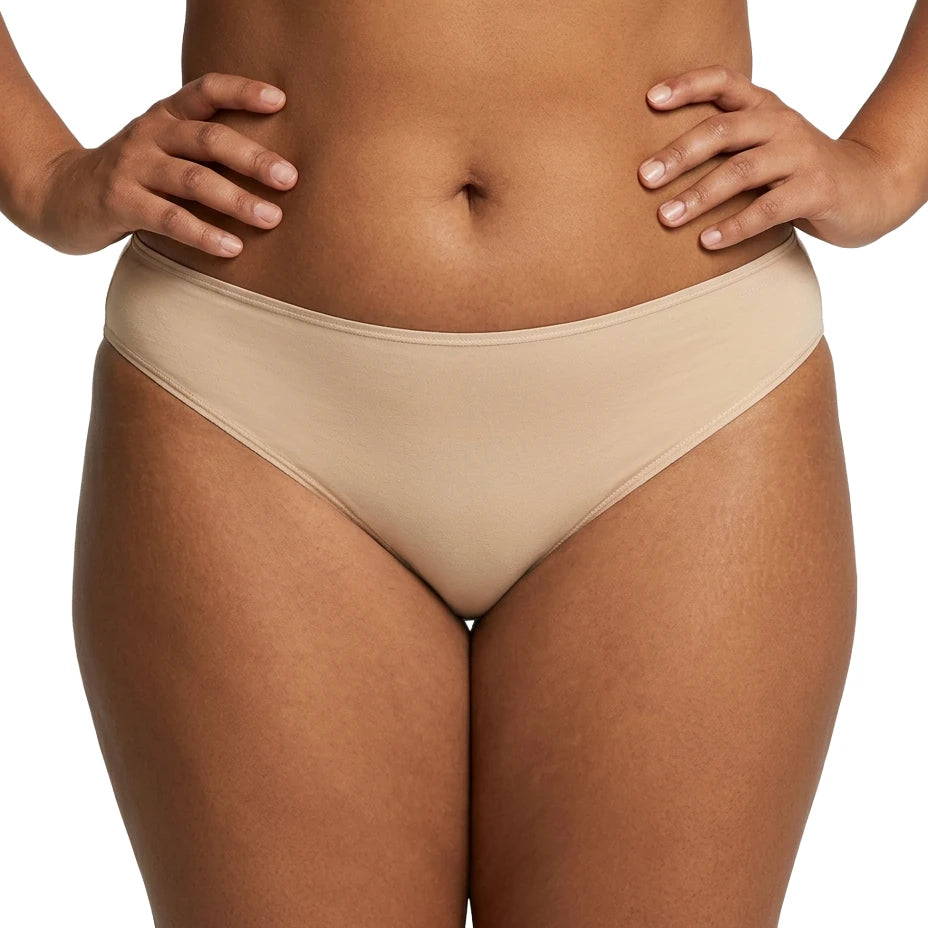 Beige underwear worn by a person on a white background