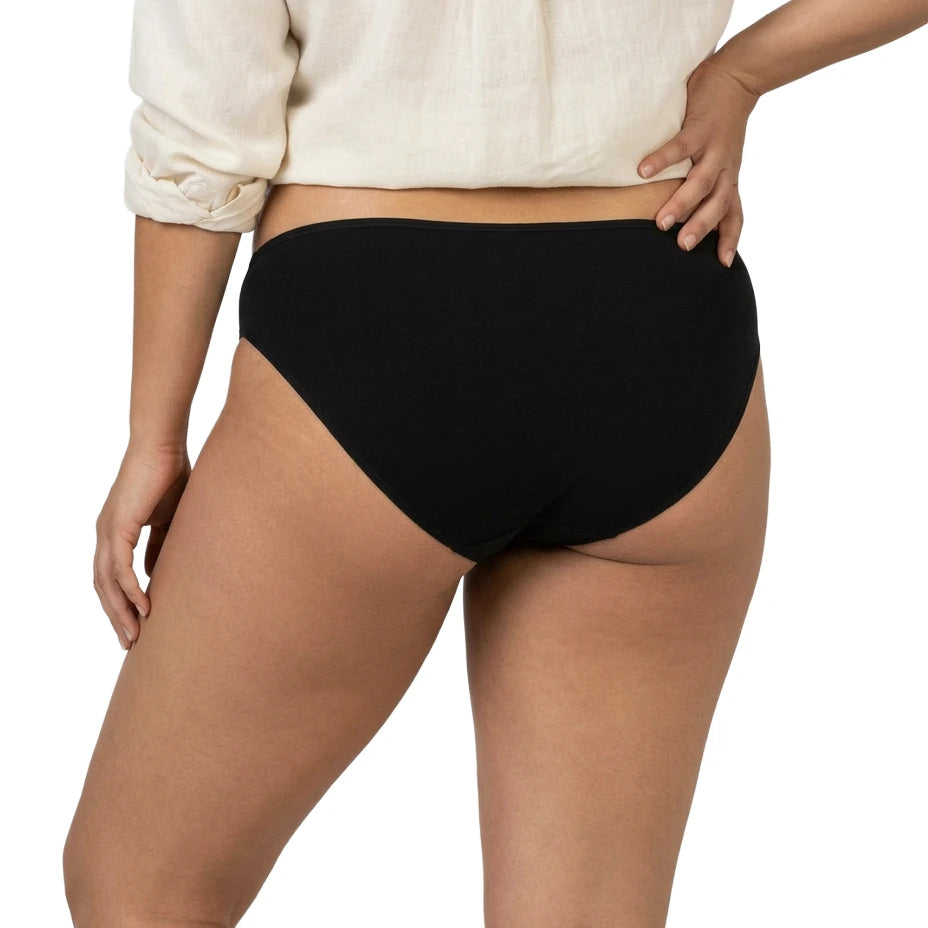 Person wearing black high-waisted underwear on a white background