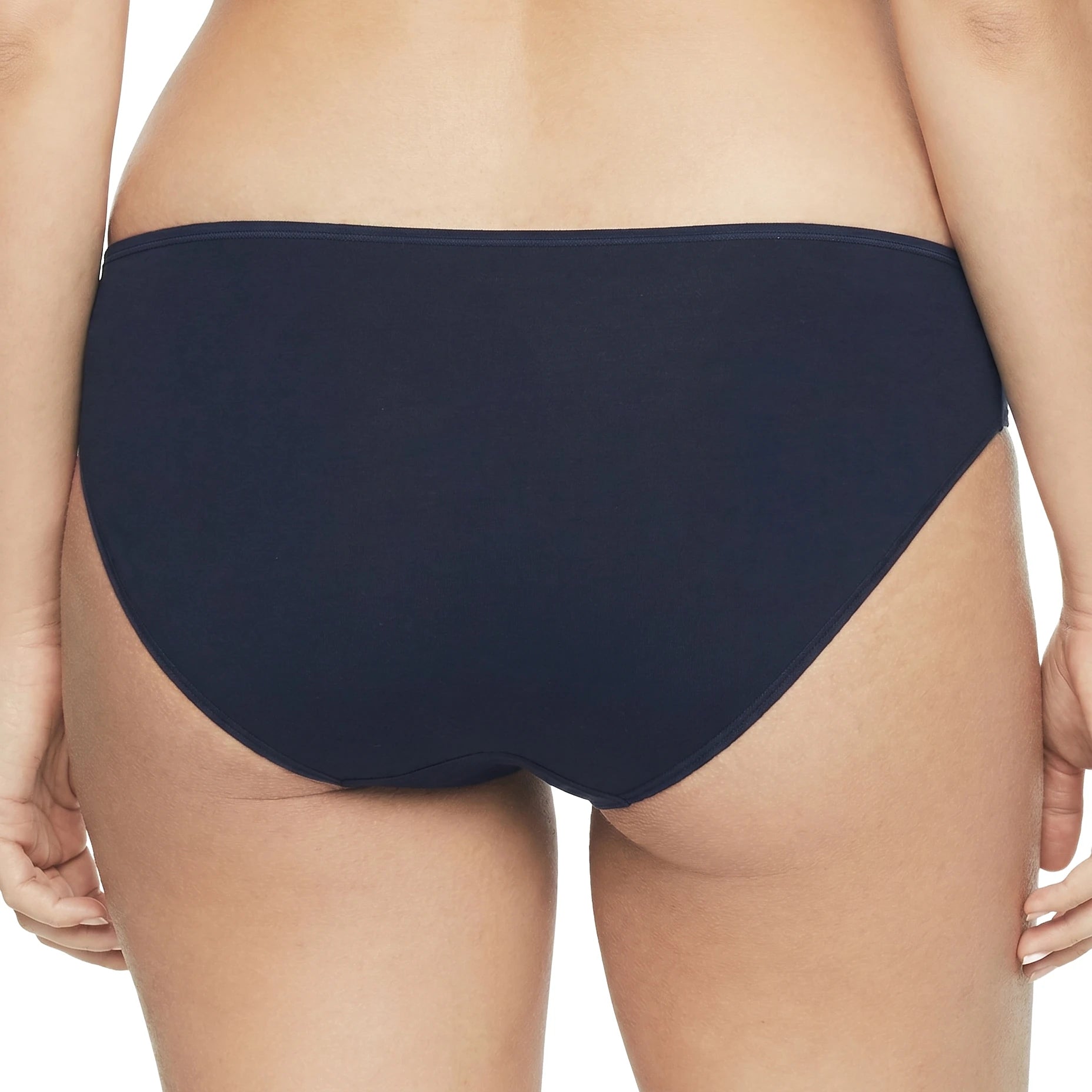 Navy blue bikini bottom worn by a person on a white background