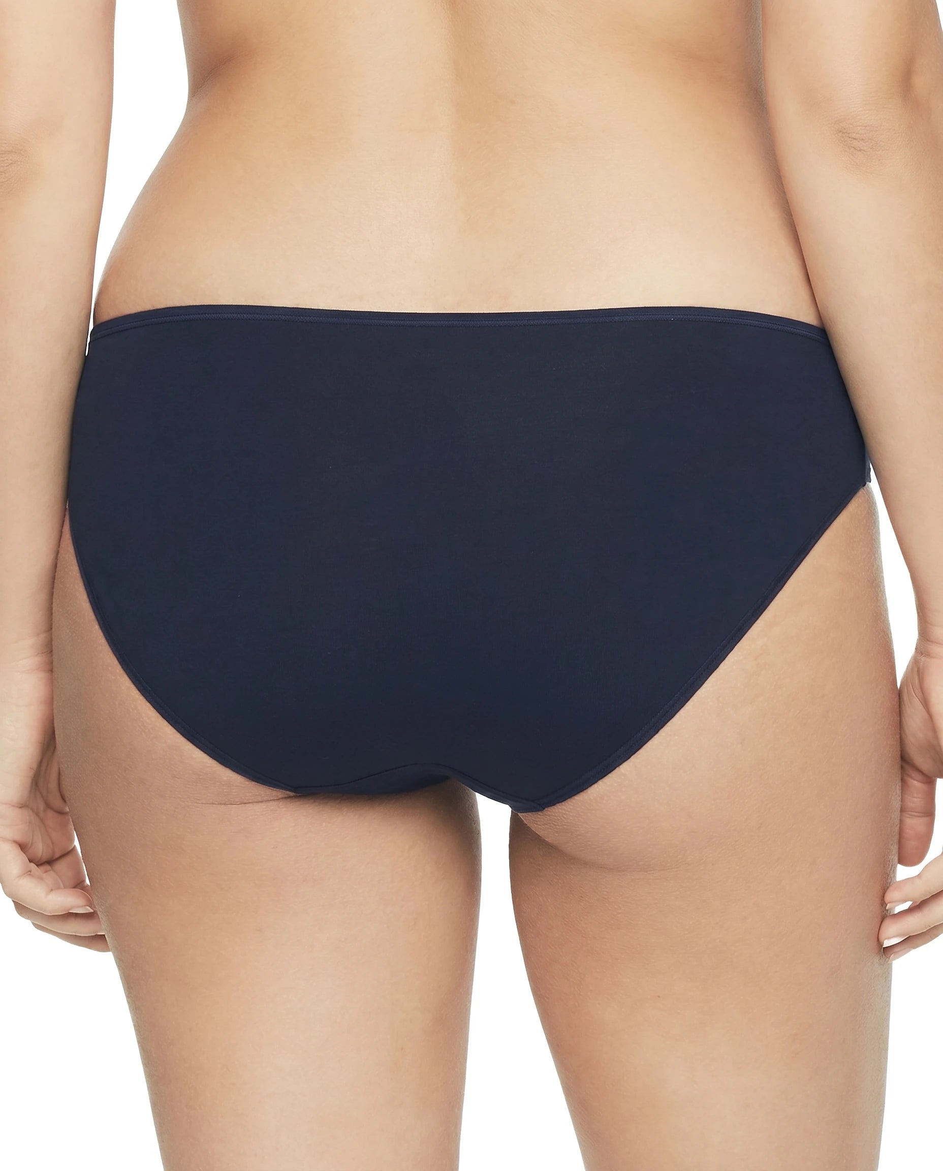 Navy blue bikini bottom worn by a person on a white background