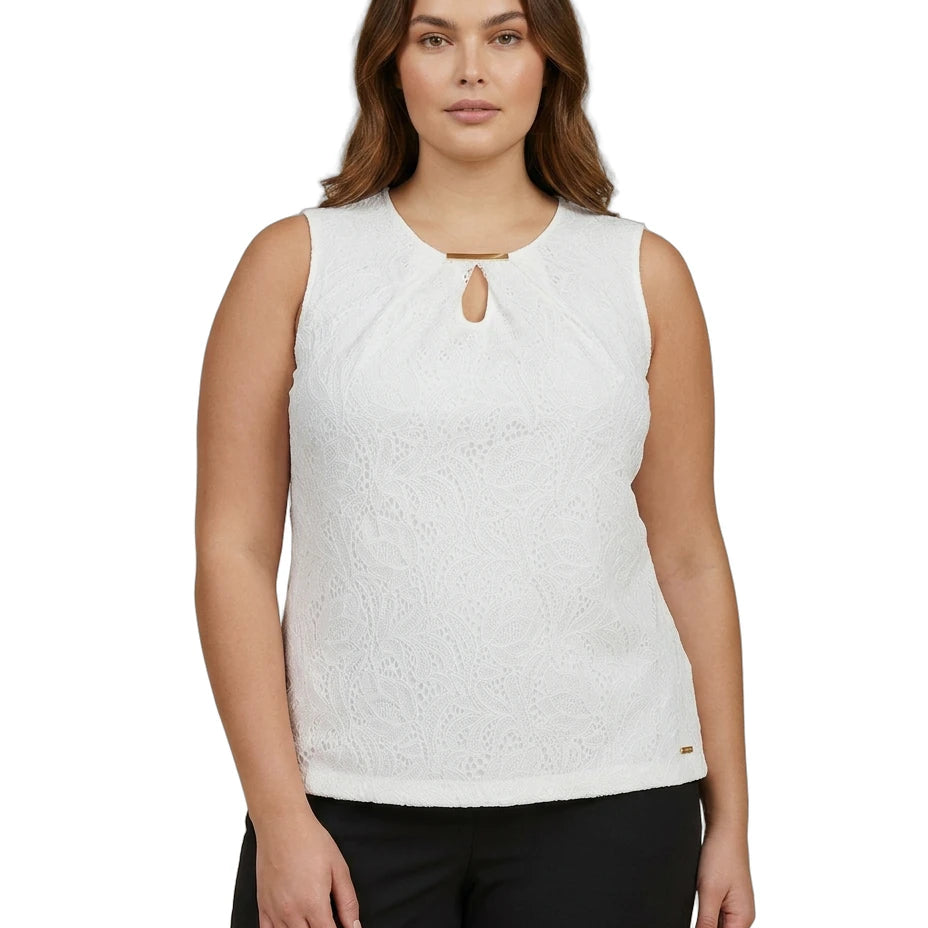Woman wearing a white sleeveless Calvin Klein top with a cut-out design on a white background