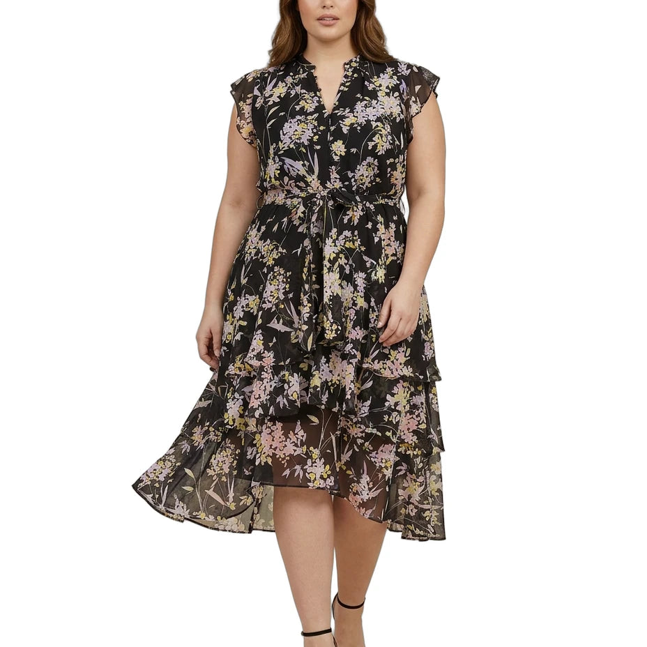 Woman wearing a Calvin Klein floral dress on a white background