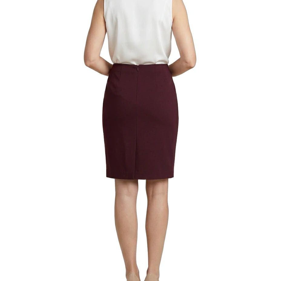 Woman wearing a white blouse and Calvin Klein burgundy skirt on a white background