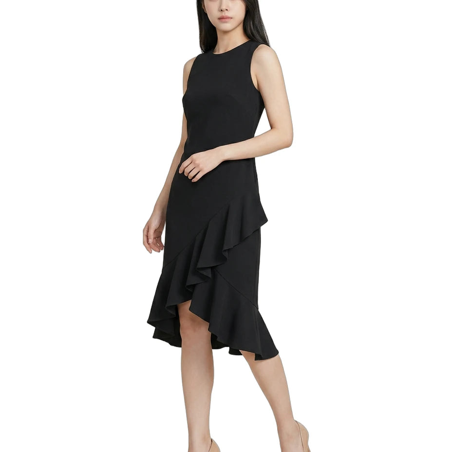 Woman wearing a black Calvin Klein dress with a ruffled skirt on a white background