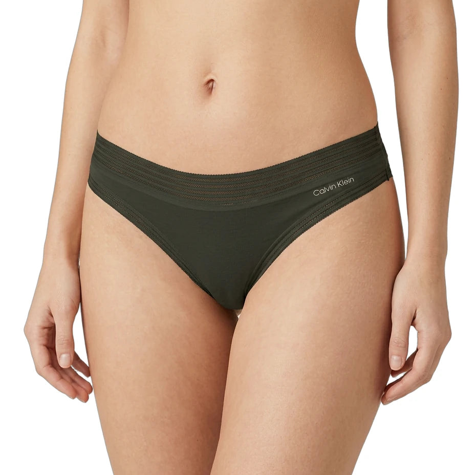 Person wearing olive green Calvin Klein underwear on a white background