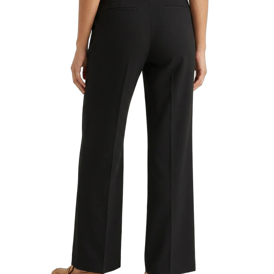 Black Calvin Klein pants worn by a person on a white background