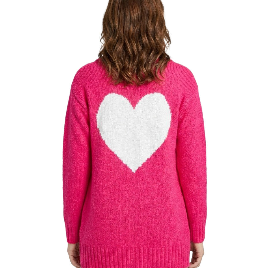 Person wearing a pink sweater with a white heart design on the back against a white background