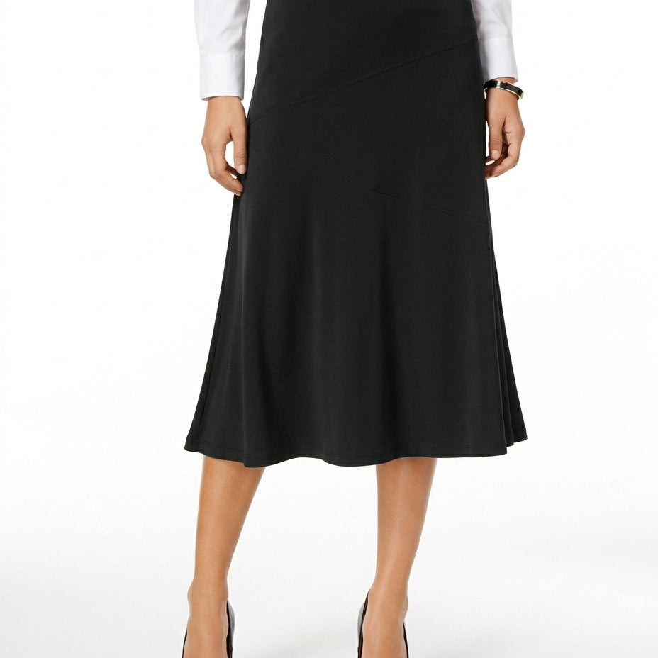 Woman wearing a black skirt with a white shirt on a white background