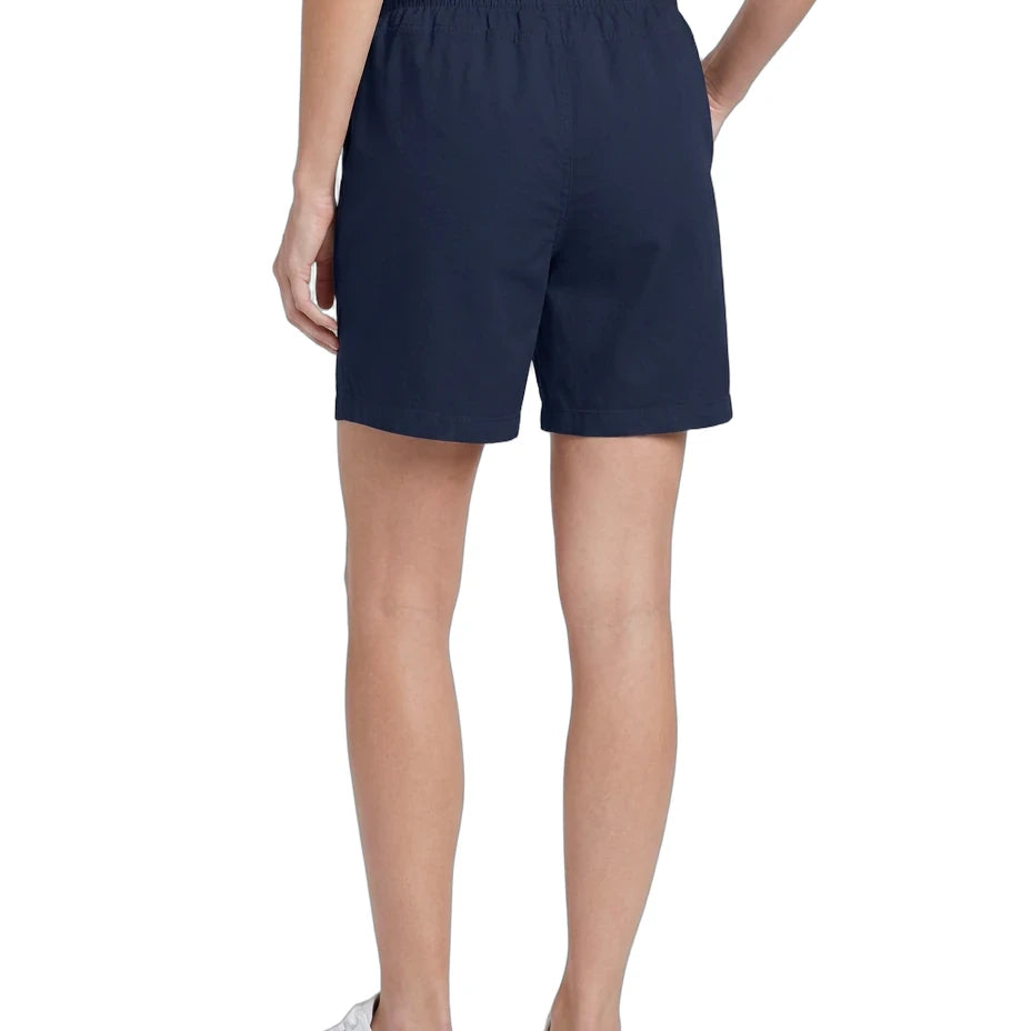 Person wearing navy shorts on a white background