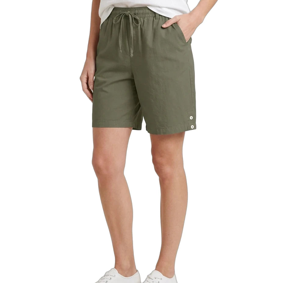 Person wearing olive green shorts on a white background