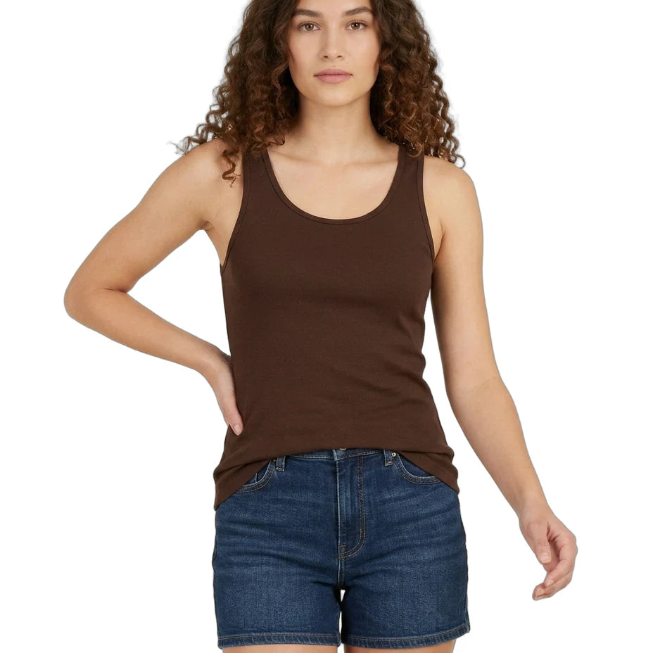 Woman wearing a brown tank top and blue shorts on a white background