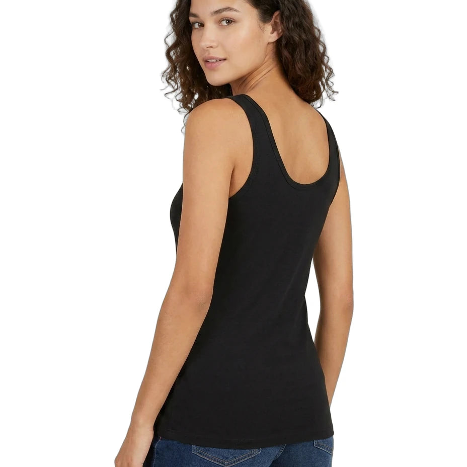Woman wearing a black tank top and blue shorts on a white background