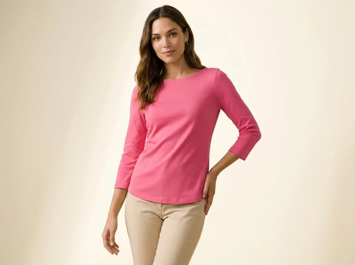 Brunette woman modeling a Charter Club bright pink boatneck three-quarter sleeve top paired with beige trousers[cite: 30].