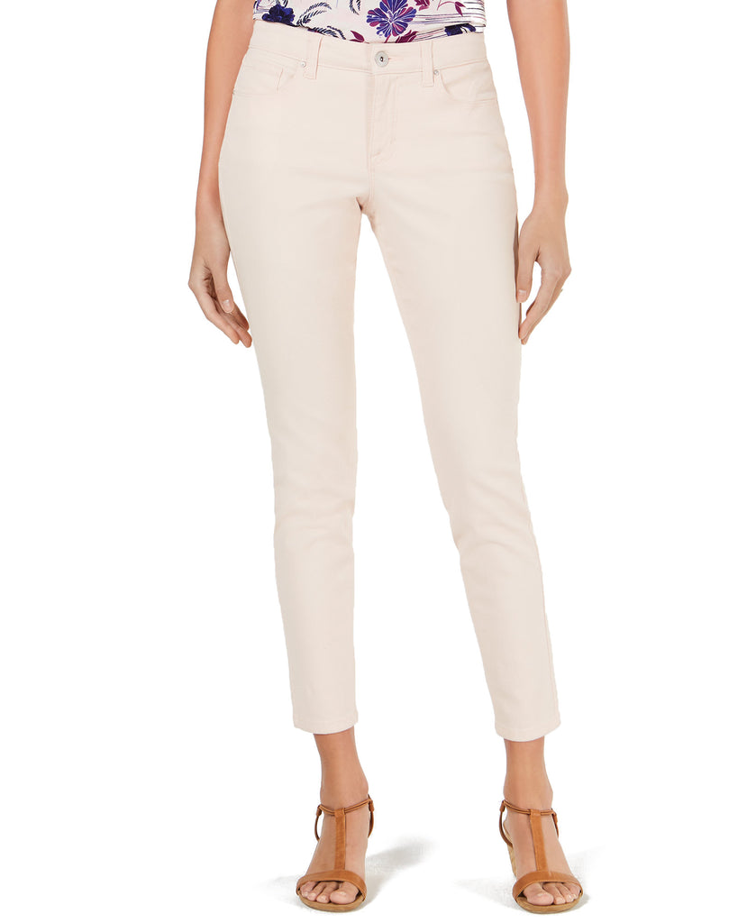 Beige pants worn by a person on a white background