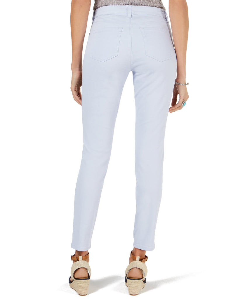 Light blue jeans worn by a person on a white background