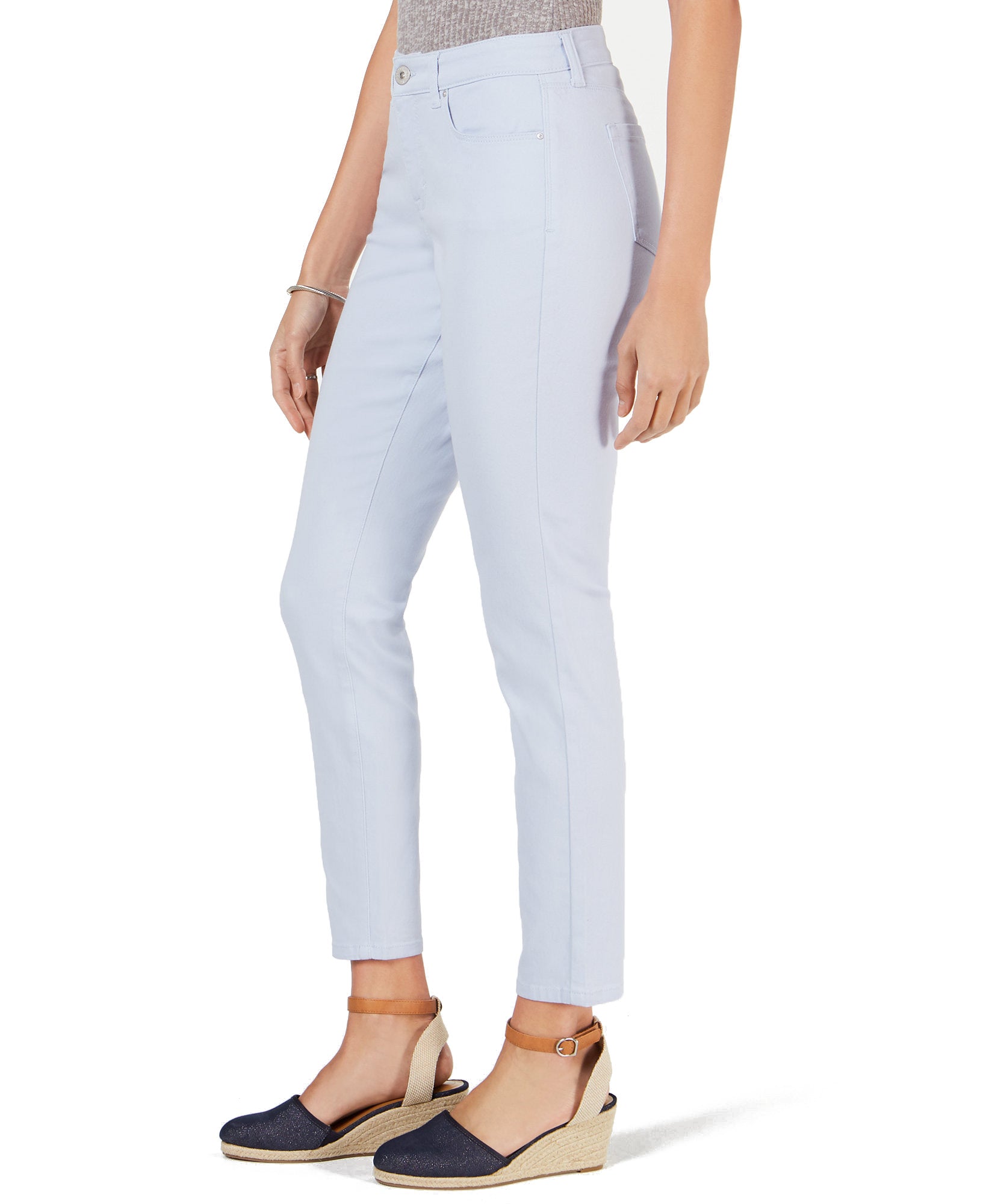 Light blue jeans worn by a person on a white background