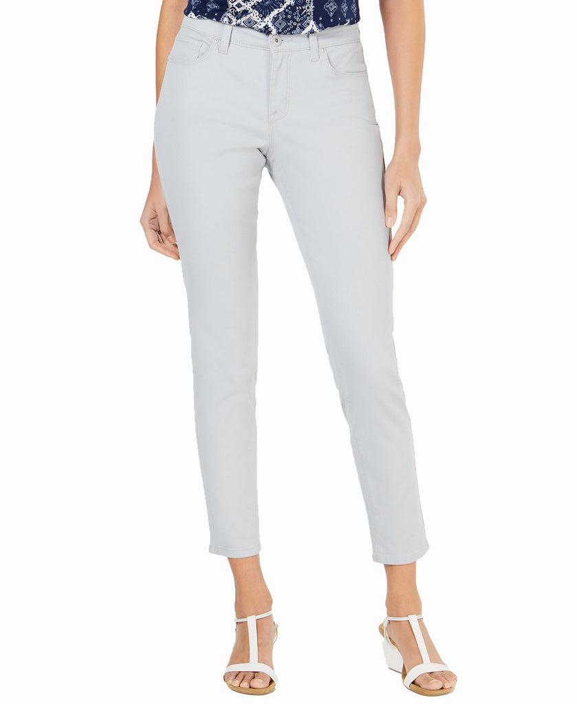 Light gray jeans worn by a person on a white background