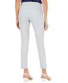 Light gray pants worn by a person on a white background
