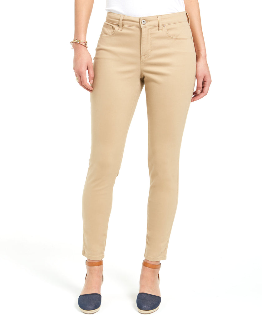 Beige pants worn by a person on a white background