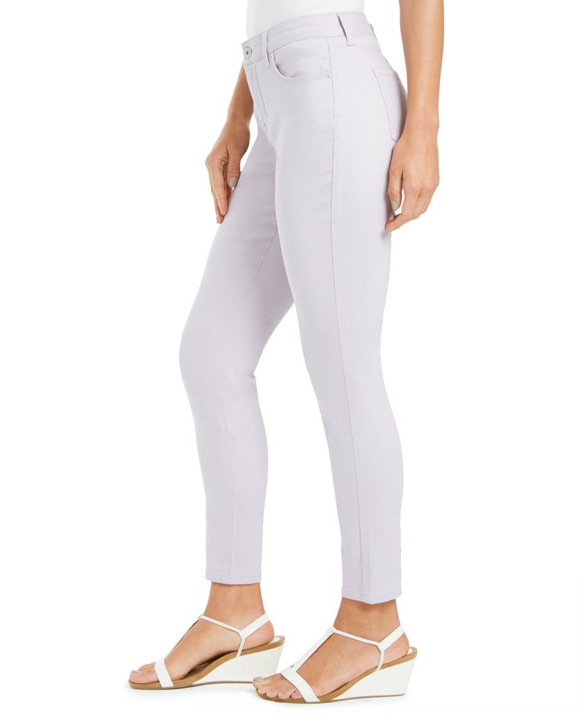 Light purple jeans worn by a person on a white background