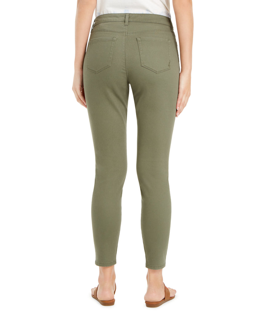 Person wearing olive green pants on a white background