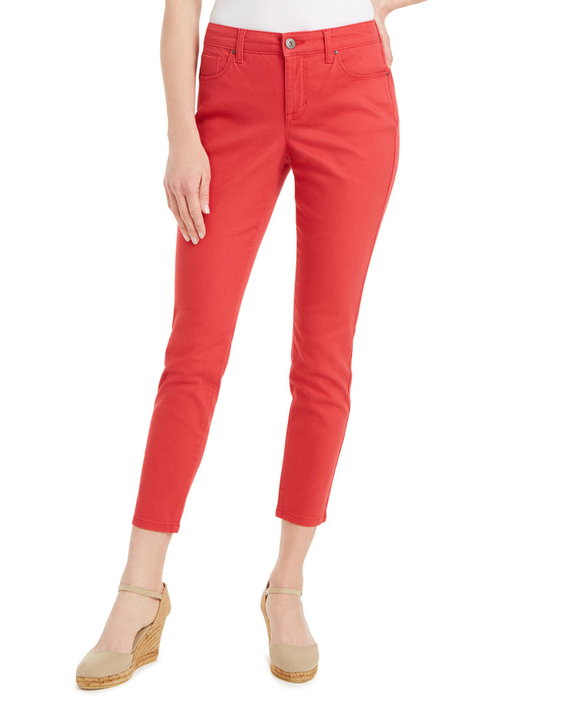 Red pants worn by a person on a white background