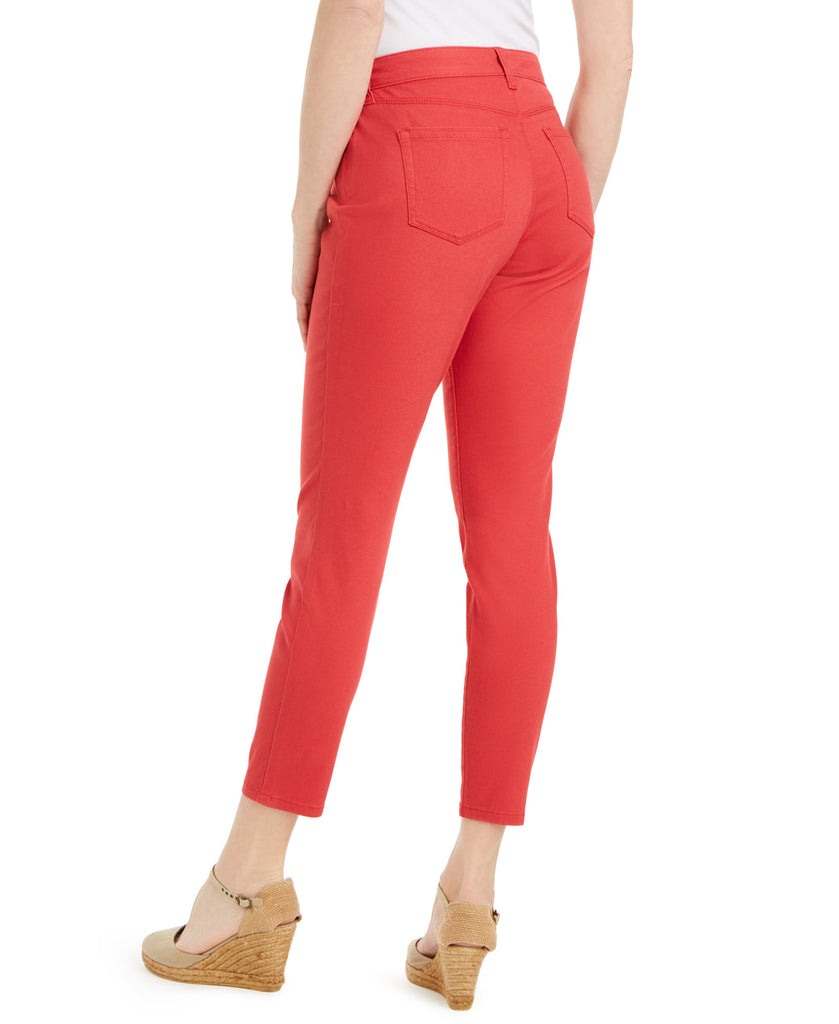 Red pants worn by a person on a white background