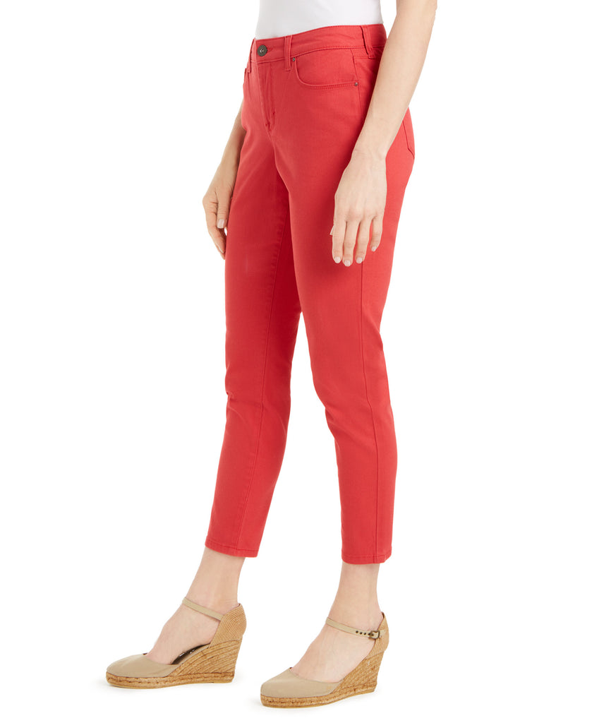 Red pants worn by a person on a white background