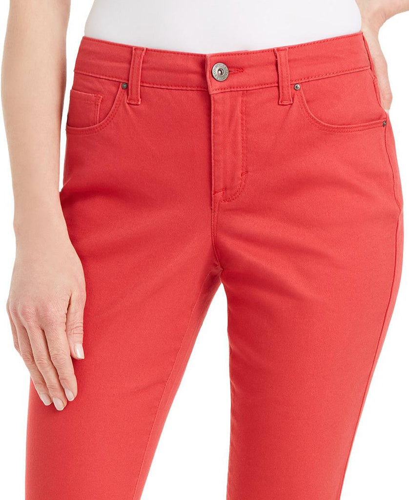 Red pants worn by a person on a white background