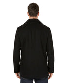 Man wearing a black coat from behind on a white background