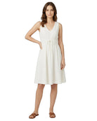 Woman wearing a white dress on a white background