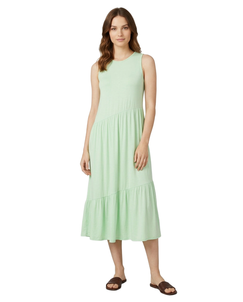 Woman wearing a light green dress on a white background