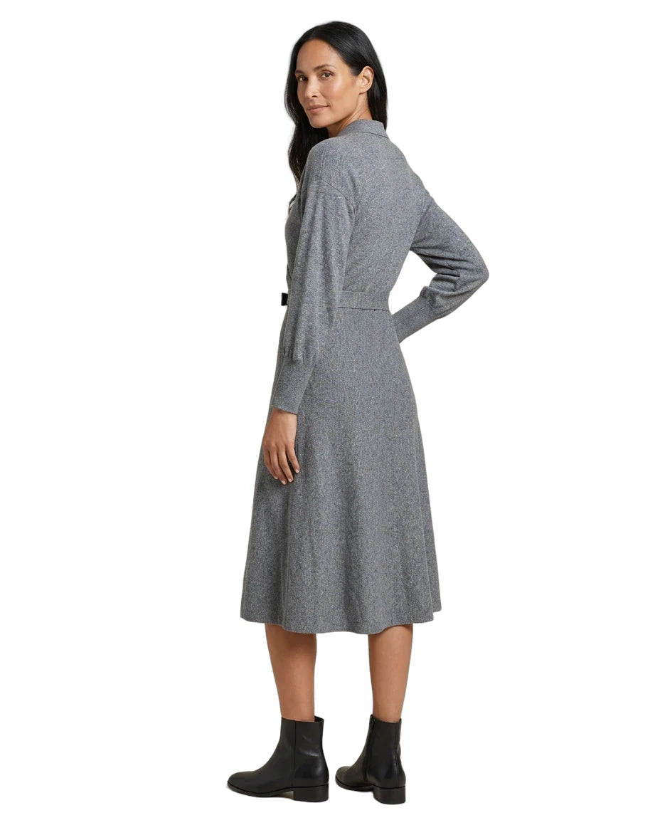 A woman modeling a gray long-sleeve midi dress with a textured pattern, shown from a side-back angle against a plain white background.