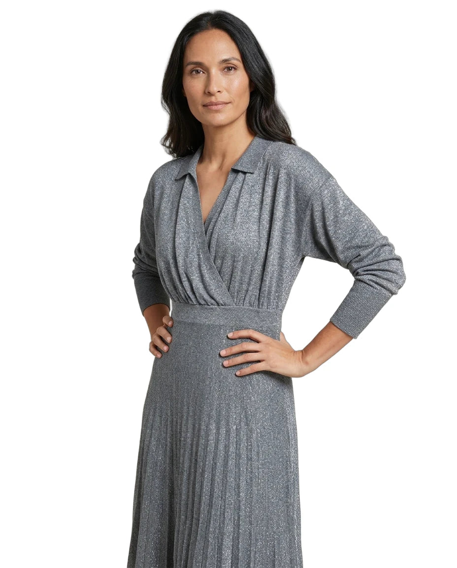 A woman modeling a long-sleeve gray knit wrap dress with a textured, shimmering finish, set against a plain white background.
