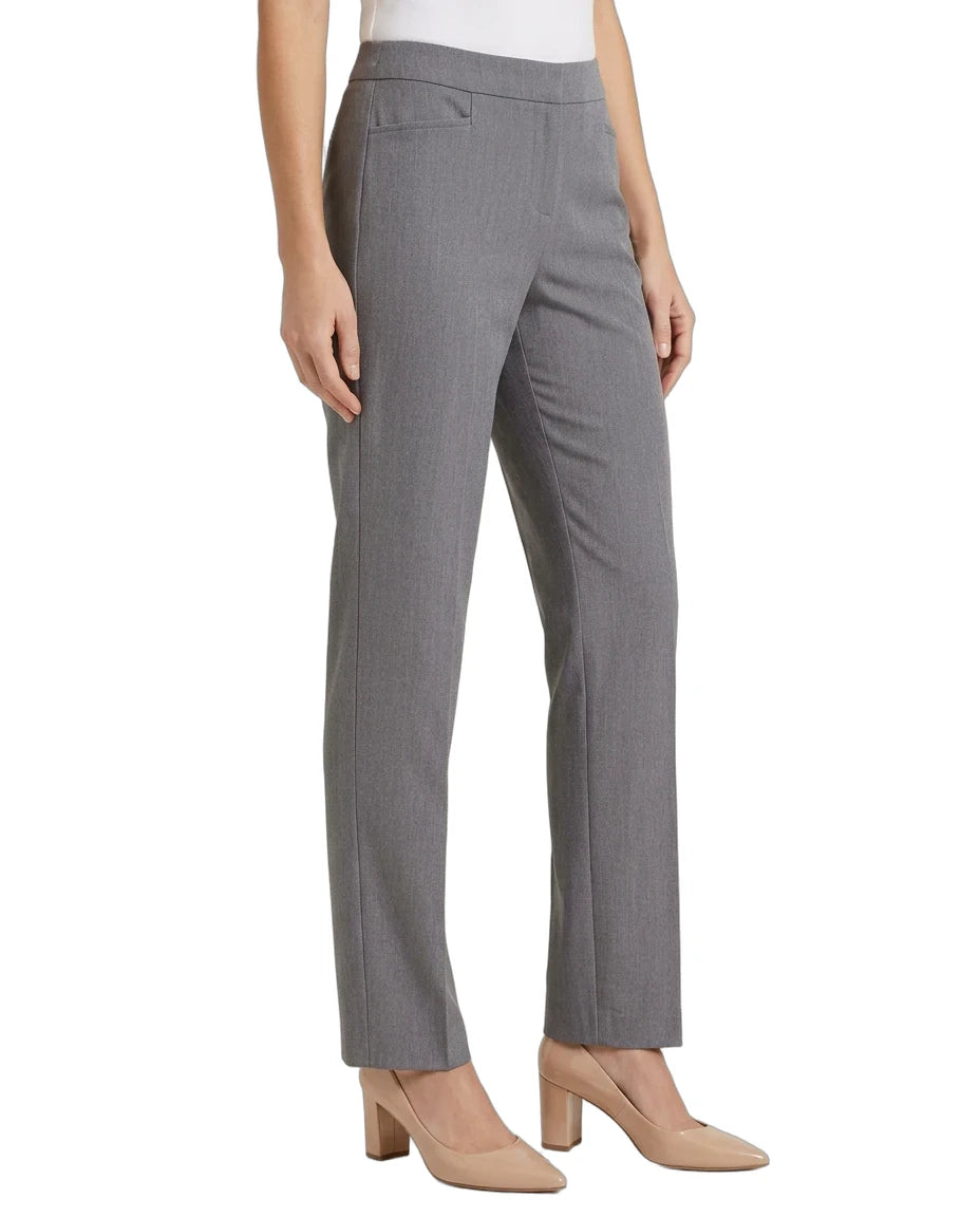 A model wearing gray straight-leg trousers with a white top and beige heels, shown from the waist down on a white studio background.