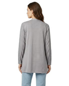 Woman wearing a gray long-sleeve top on a white background