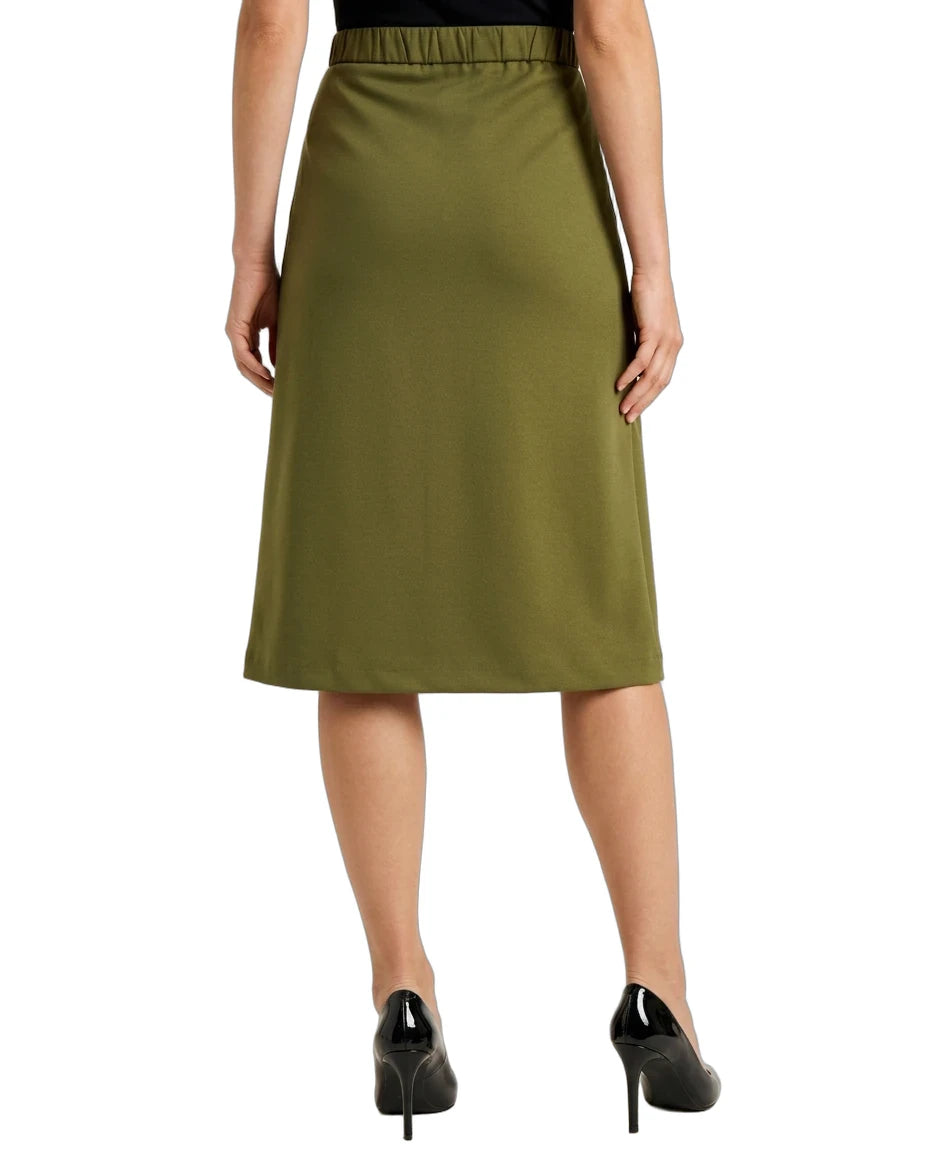 An olive green knee-length A-line skirt with an elastic waistband, shown on a model from the back wearing black patent high heels against a white background.