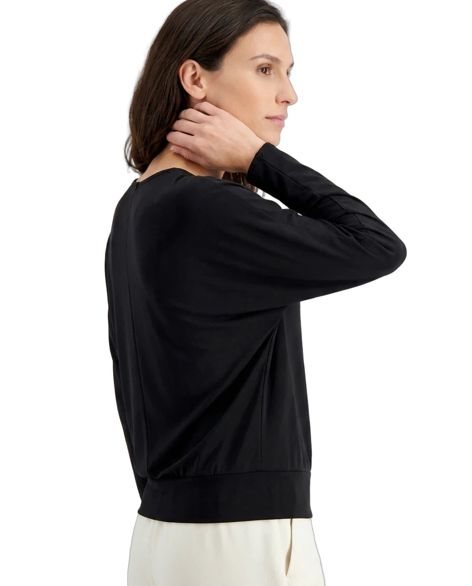 Woman wearing a black sweater on a white background