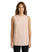 Woman wearing a light pink sleeveless top on a white background