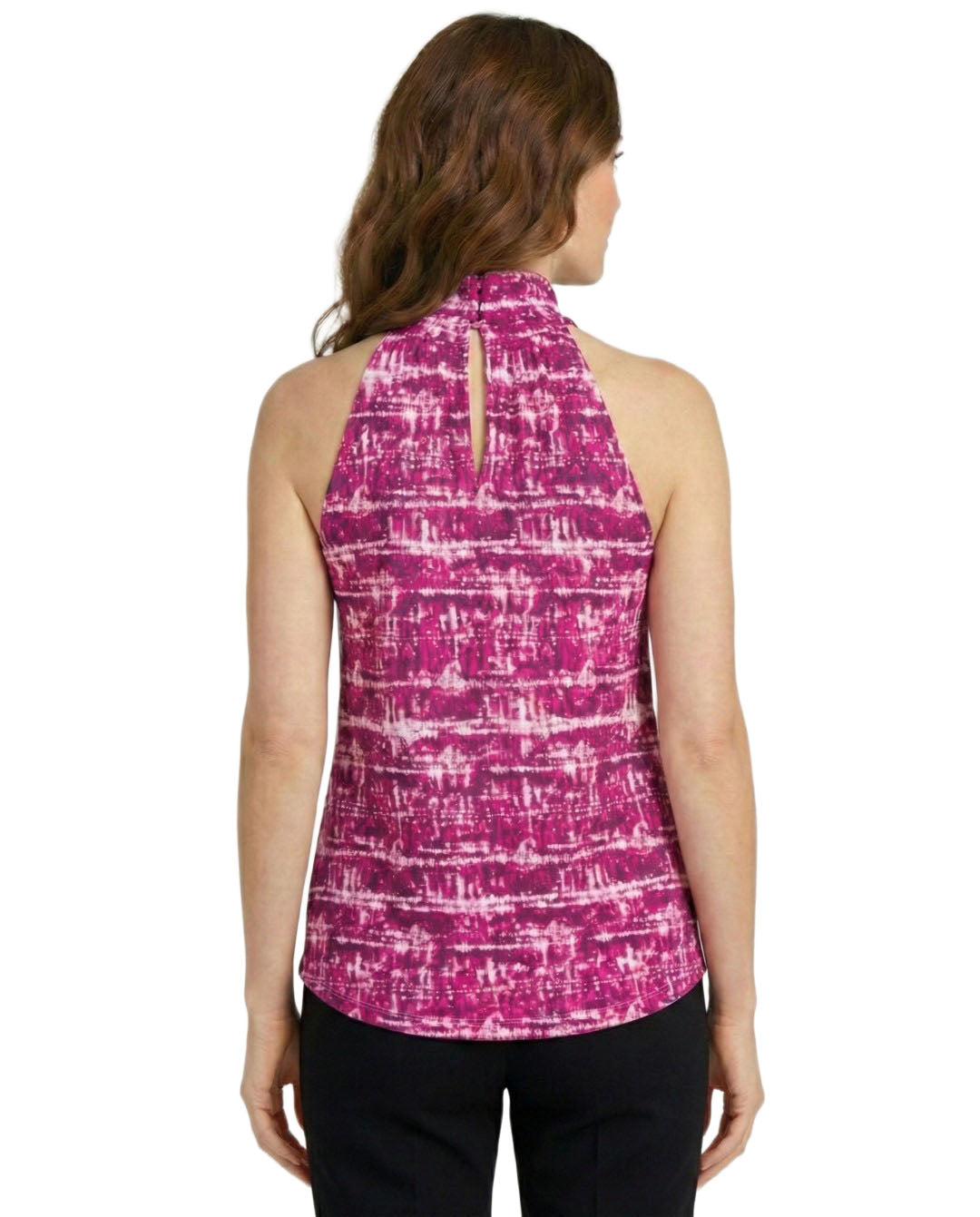 Woman wearing a pink patterned sleeveless top on a white background