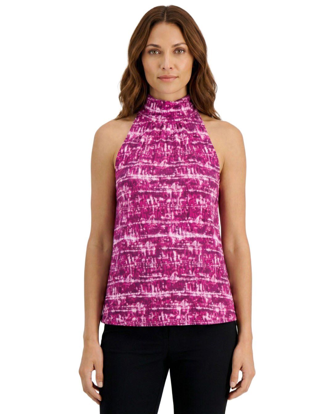 Woman wearing a pink and purple patterned sleeveless top on a white background