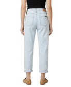 Light blue Calvin Klein jeans worn by a person on a white background