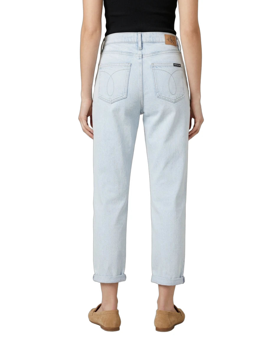 Light blue Calvin Klein jeans worn by a person on a white background
