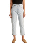 Light blue Calvin Klein jeans worn by a person on a white background