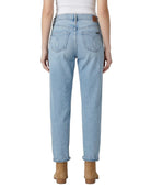 Light blue Calvin Klein jeans worn by a person on a white background