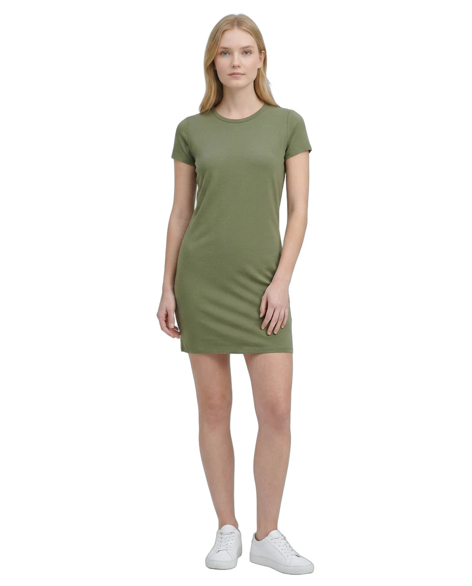 Woman wearing a green Calvin Klein dress on a white background