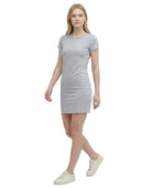 Woman wearing a gray Calvin Klein t-shirt dress on a white background