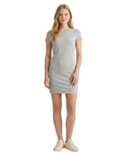 Woman wearing a gray Calvin Klein dress on a white background