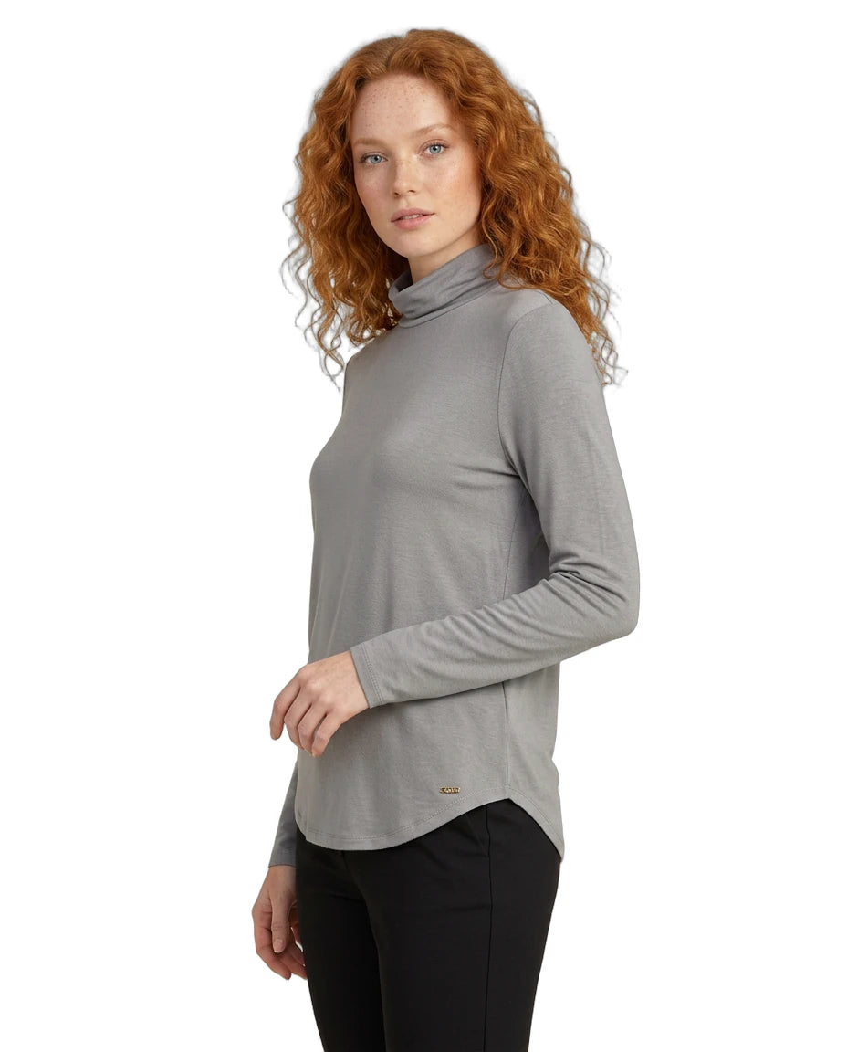 Woman wearing a gray turtleneck sweater on a white background
